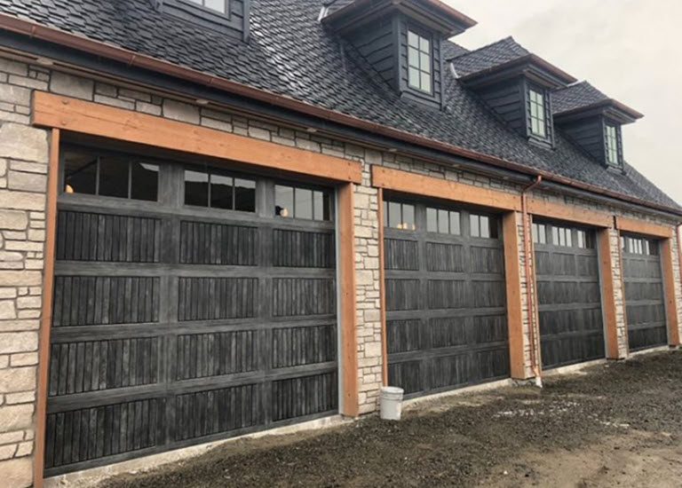 Garage Door Transformation with 4 new garage doors with windows