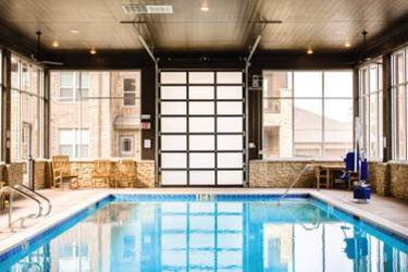 aluminum garage door in pool area of hotel